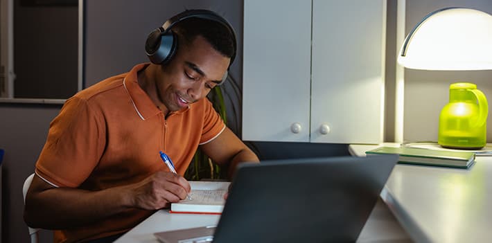 Man working at a laptop at home